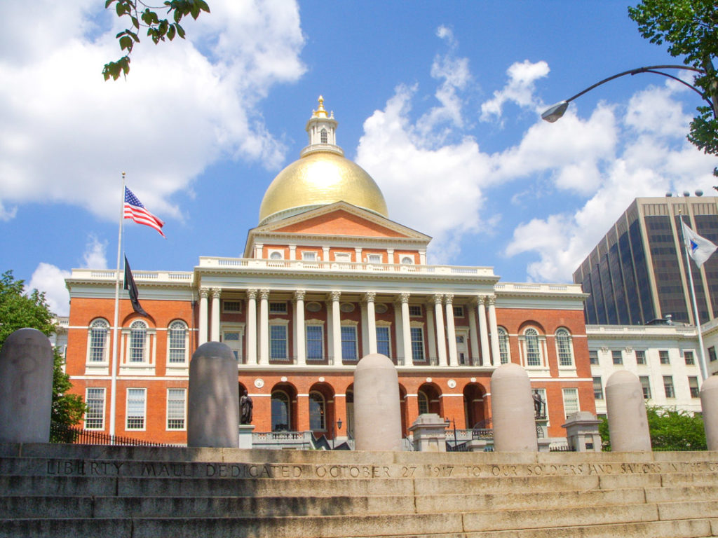 Orange Massachusetts State House with gold dome roof in Boston