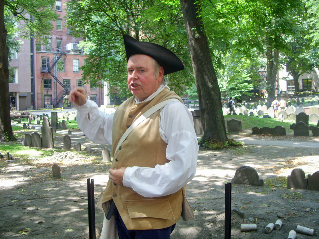 Tour guide dressed in colonial costume in Boston Granary Burying Ground
