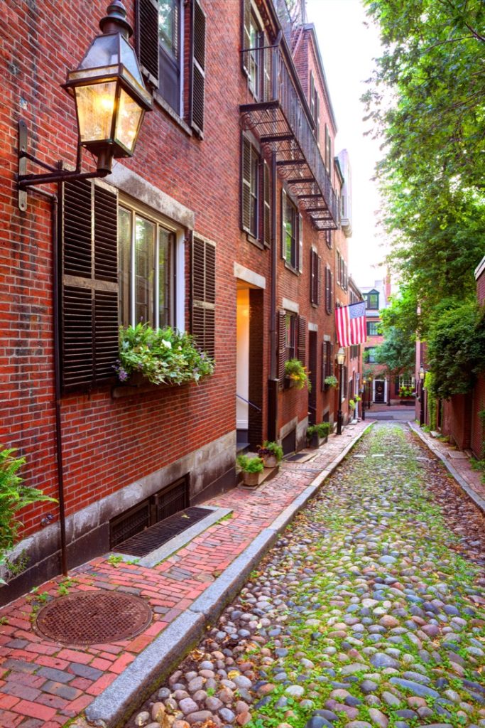 Cobblestone and red brick building on Acorn street Beacon Hill 