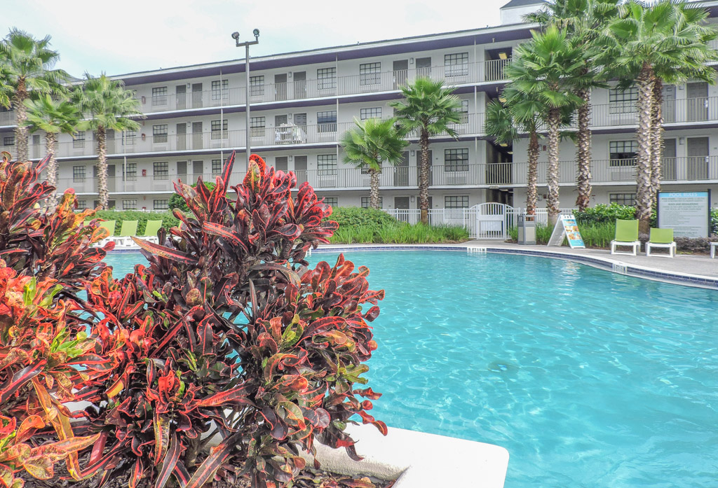 Outdoor pool and buildings at Avanti Resort iDrive. Orlando. Florida