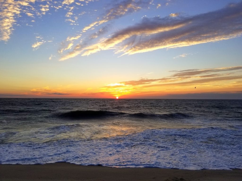 Beautiful sunrise and waves in the early morning near Dewey Beach, Delaware