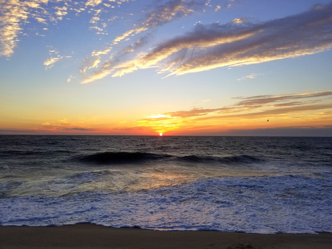 Beautiful sunrise and waves in the early morning near Dewey Beach, Delaware