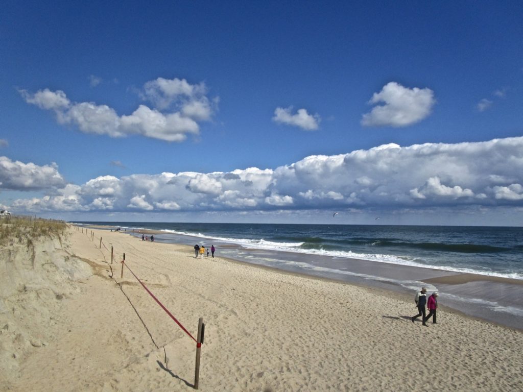 Bethany Beach, Delaware, USA. A long, low band of beautiful white clouds along the beach on the Atlantic Ocean. 