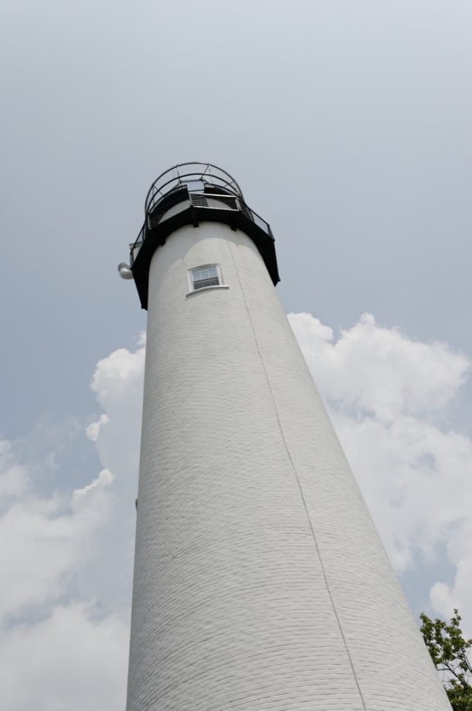 Fenwick Island white Lighthouse with grey sky in Delaware
