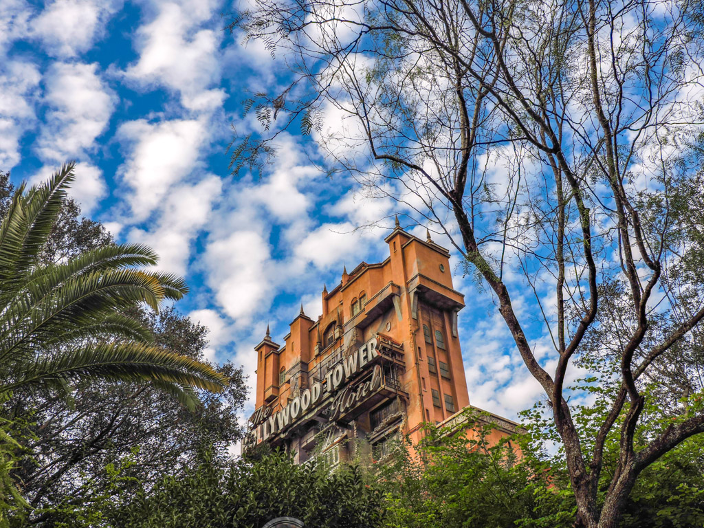 Blue skies and trees around Hollywood Tower in Orlando.