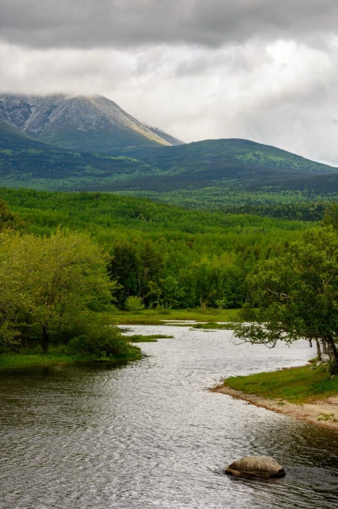 Water running through North Woods in Maine with Mount Katahdin in background