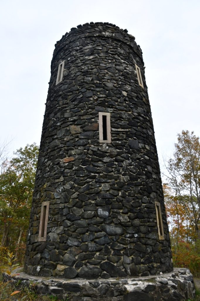 Grey stoned Mount Tom Tower at Mount Tom State Park in Washington, Connecticut. 
