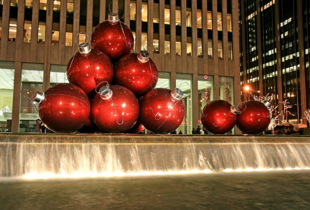 Big red bauble Christmas decor at the fountain plaza at 1251 Avenue of the Americas (Sixth Avenue) NYC