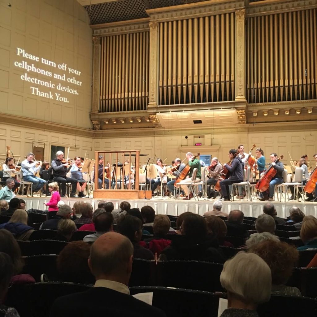 The Boston Symphony Orchestra rehearses on stage