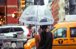 Woman umbrella in rain NYC