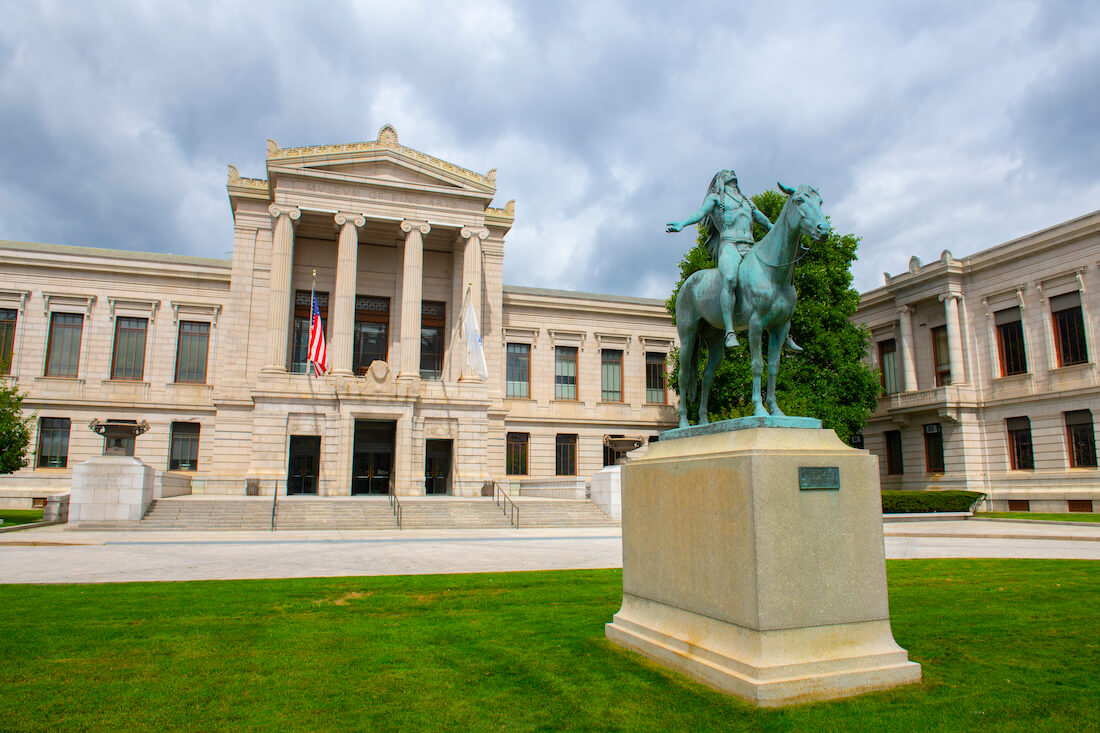 Exterior of the Museum of Fine Arts in Boston, with the statue "Appeal to the Great Spirit" in front