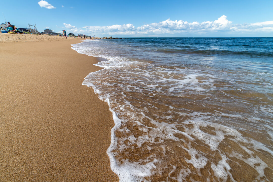 Gentle waves along the sandy beach on Plum Island in Newburyport Massachusetts