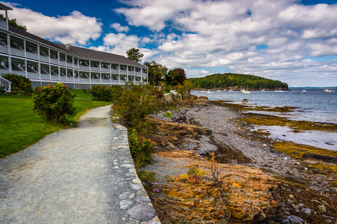 Bar Harbor Maine waterfront hotel rooms with a paved path along the shore
