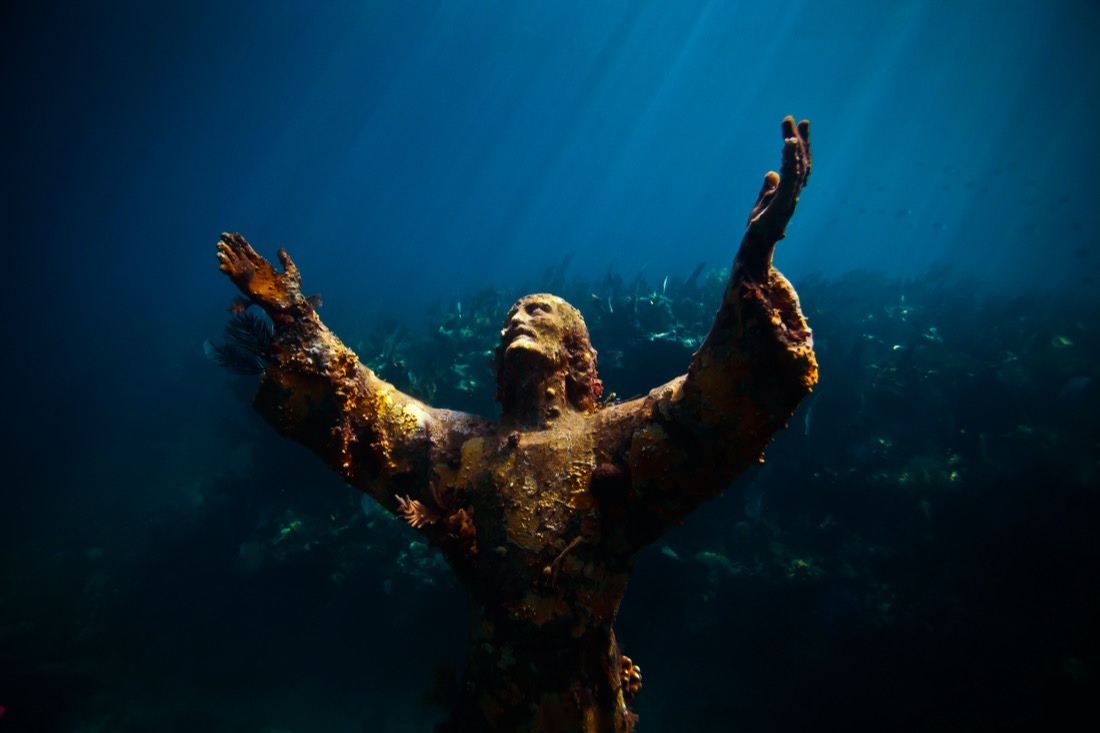 Statue of Christ of the Abyss submerged in water in Florida Keys