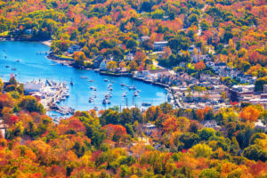 Autumn colors surround Camden Harbor, a small coastal town in Maine