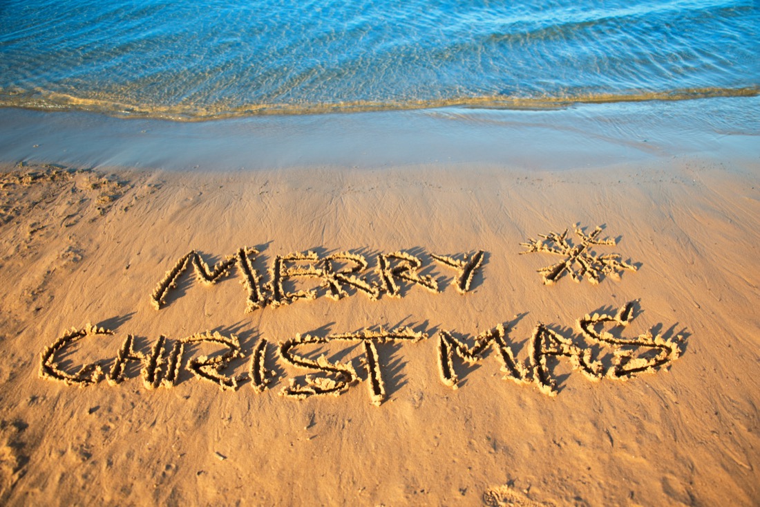 Merry Christmas outline on beach