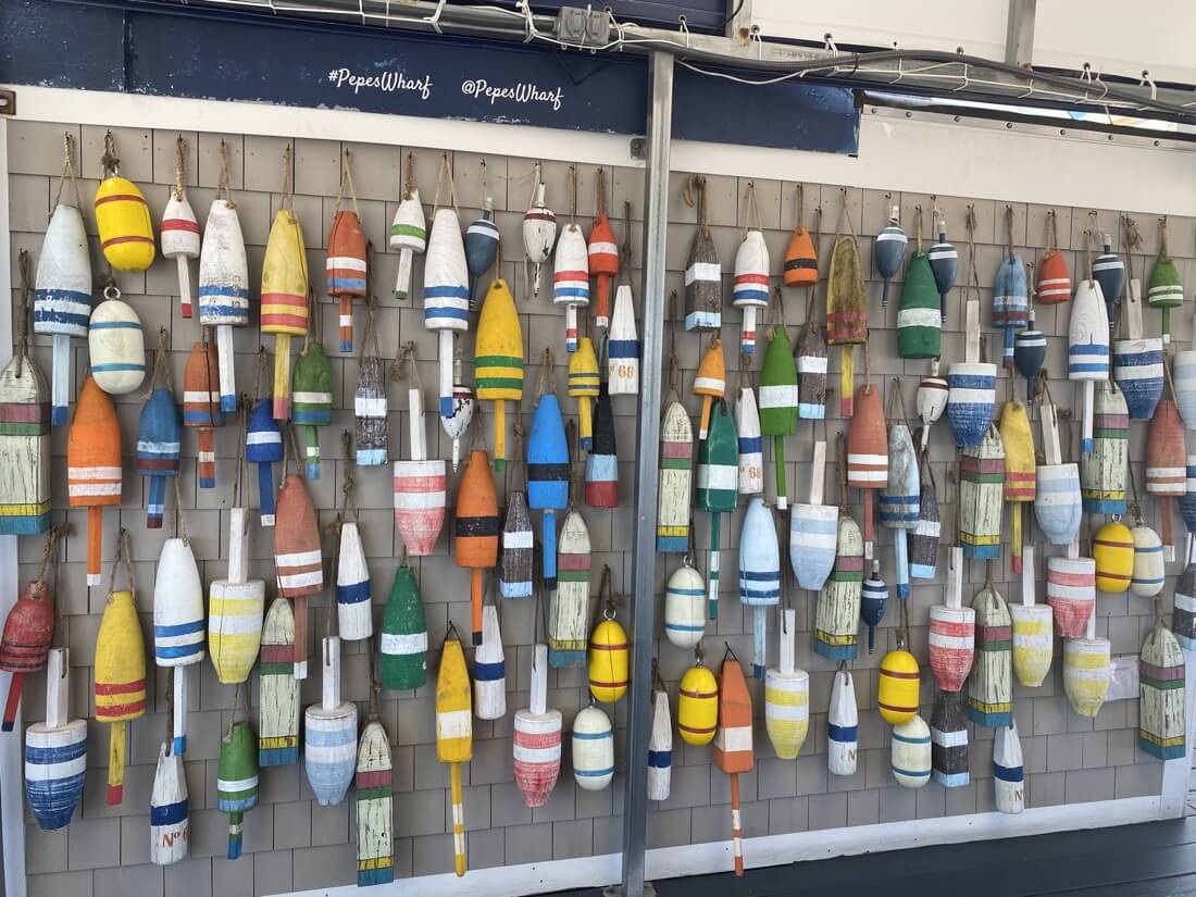 Colorful buoys on the wall at Pepes Wharf restaurant in Provincetown Massachusetts