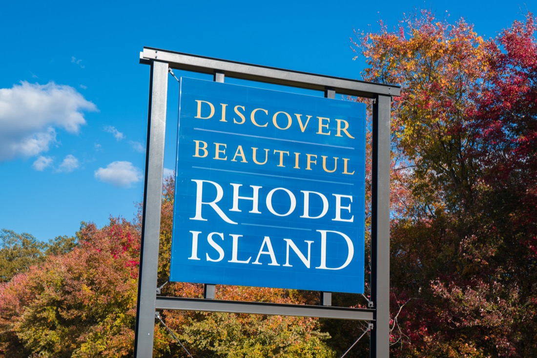 Discover Rhode Island sign with fall trees.