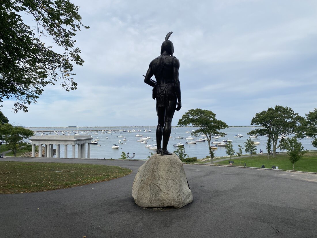 Massasoit statue overlooking Plymouth Harbor and Plymouth Rock in Massachusetts