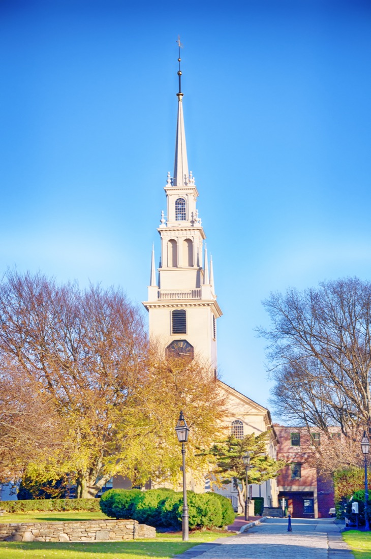 The landmark trinity church in Queen Anne Square in late autumn in Newport Rhode Island. 