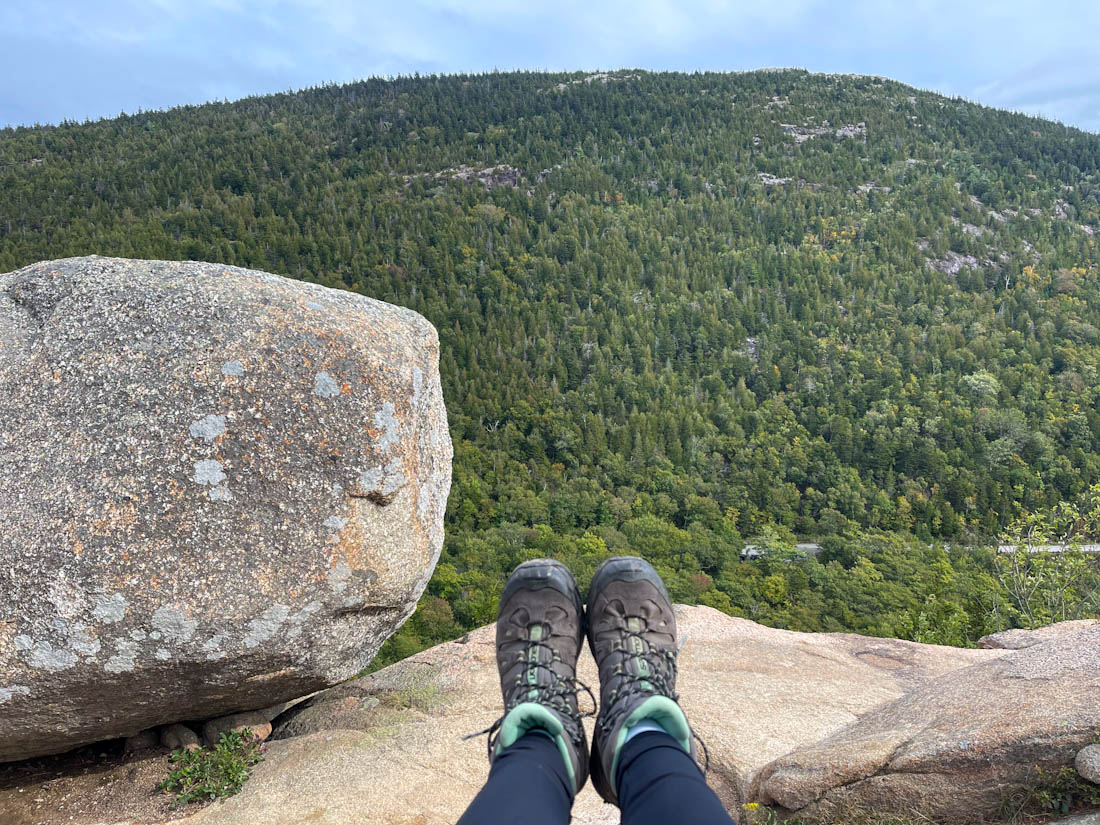 Hiking boots in Bubble Rock, Acadia National Park, Maine.