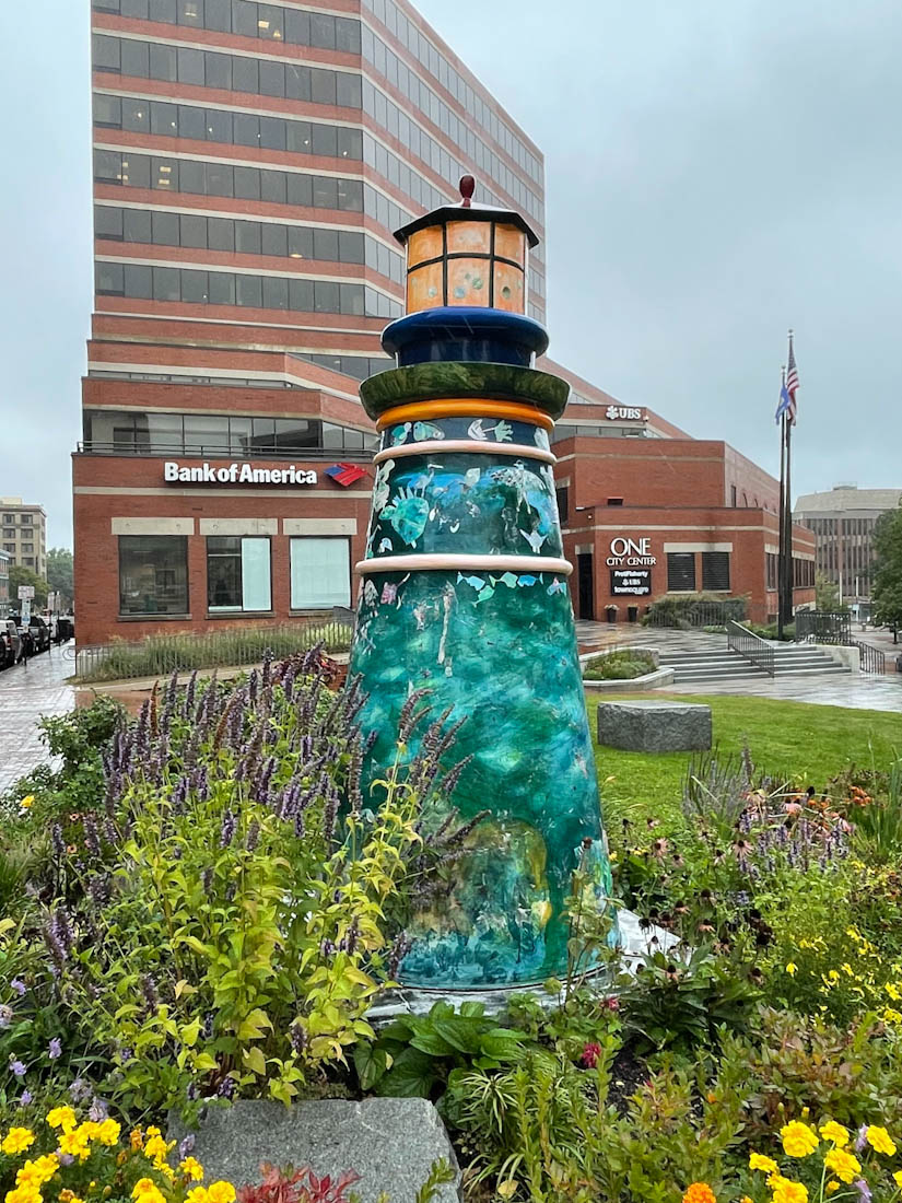 Portland Maine lighthouse artwork statue flowers