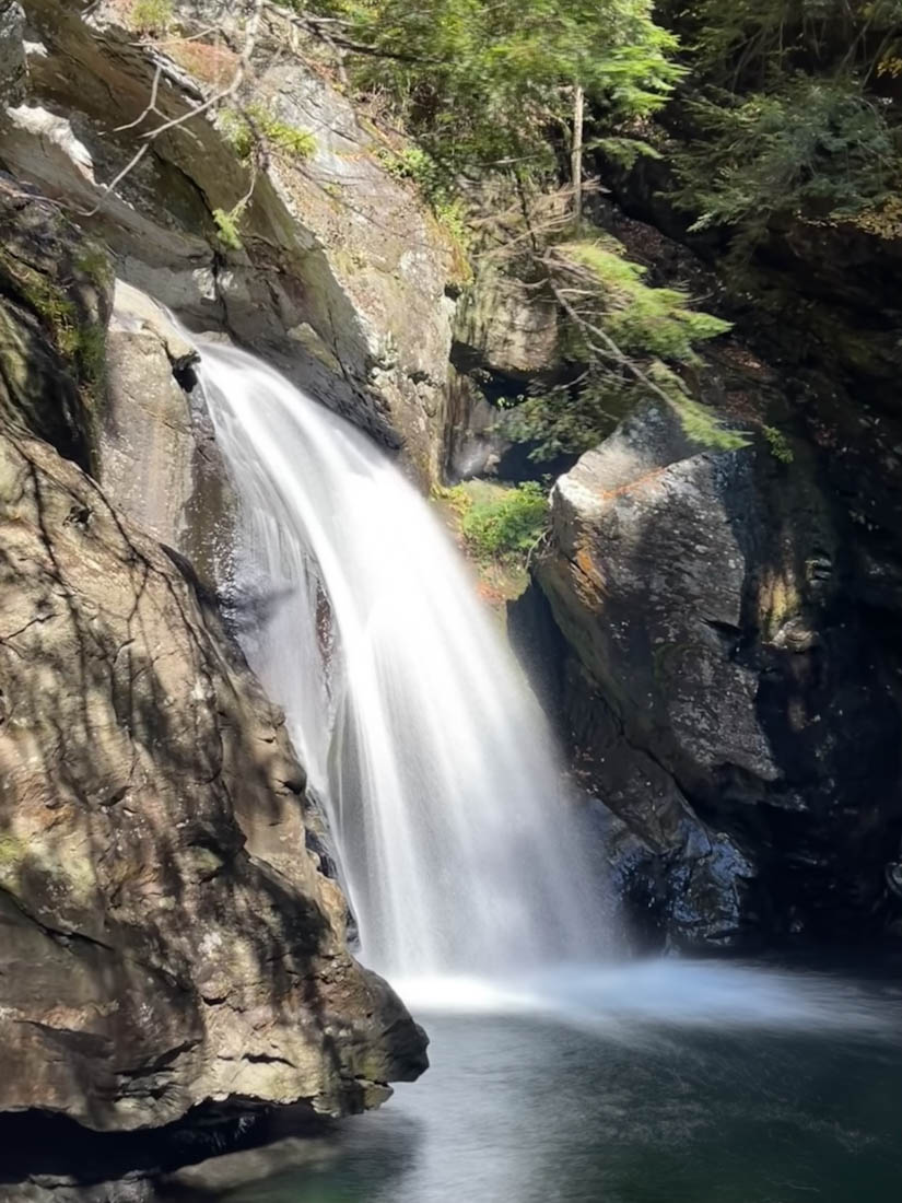 Bingham Falls flowing over rocks in in Stowe Vermont