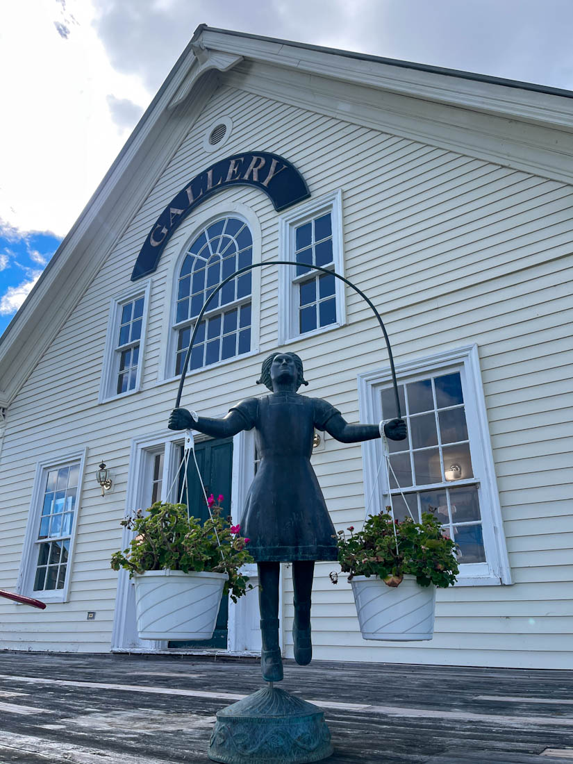 Statue of girl outside Dog Chapel Mountain Gallery St Johnsbury Vermont