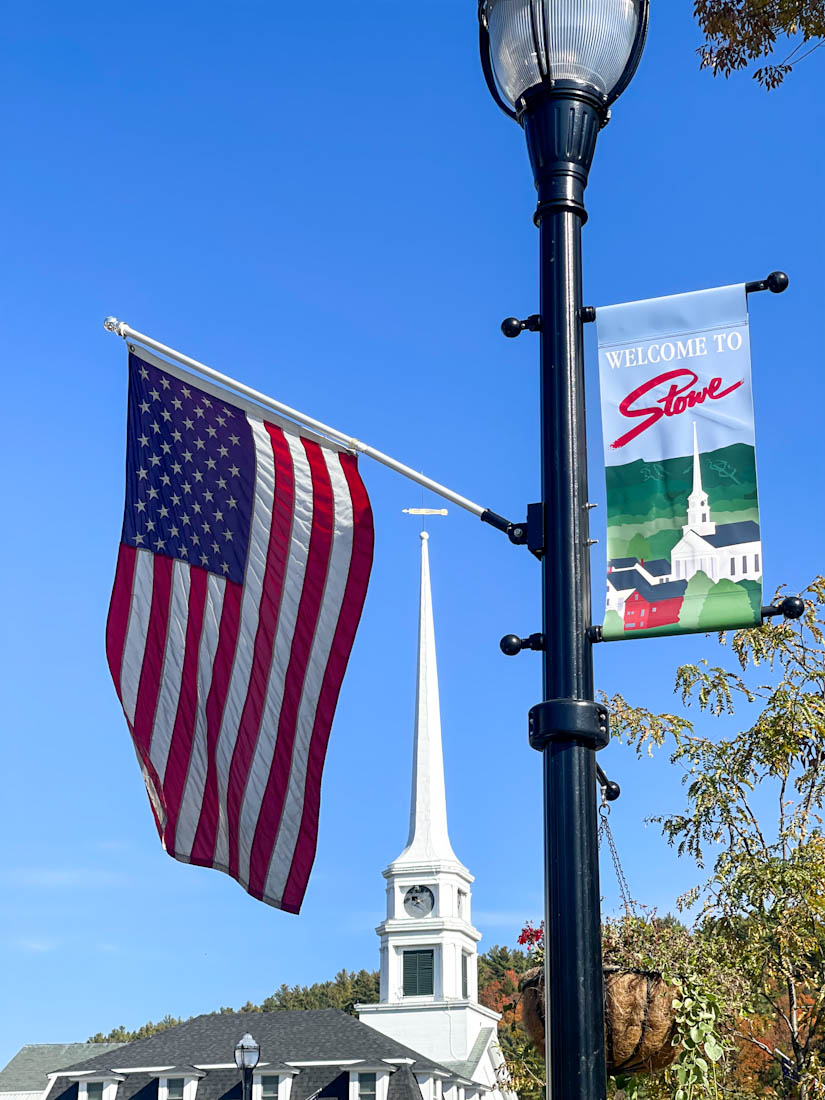 Stowe welcome sign on lamp post usa flag 