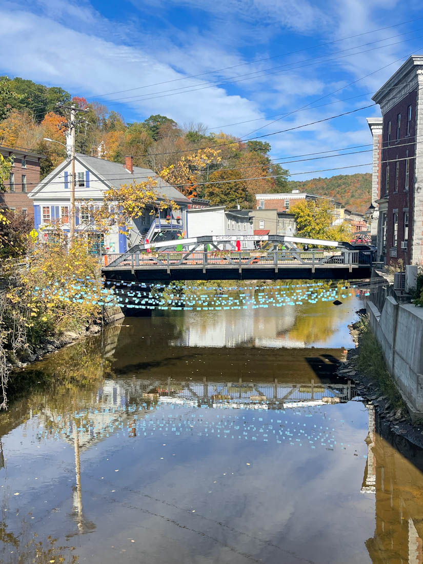 Fall colors at Winooski River bridge with bunting in Montpelier Vermont
