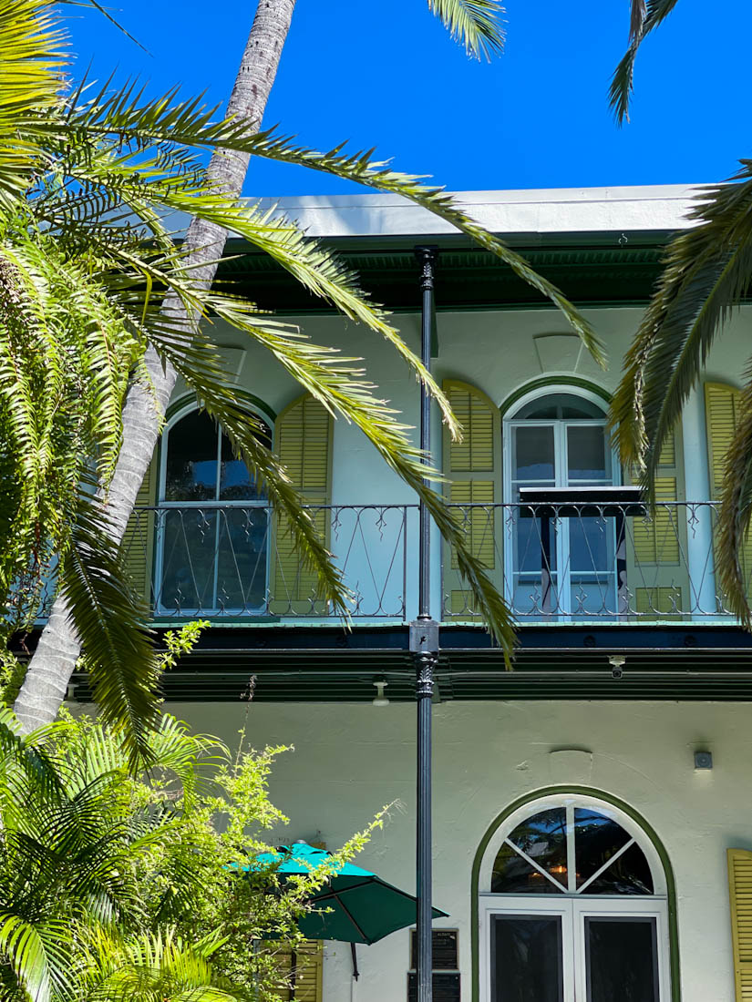 Trees framing Ernest Hemingway House Key West in Florida