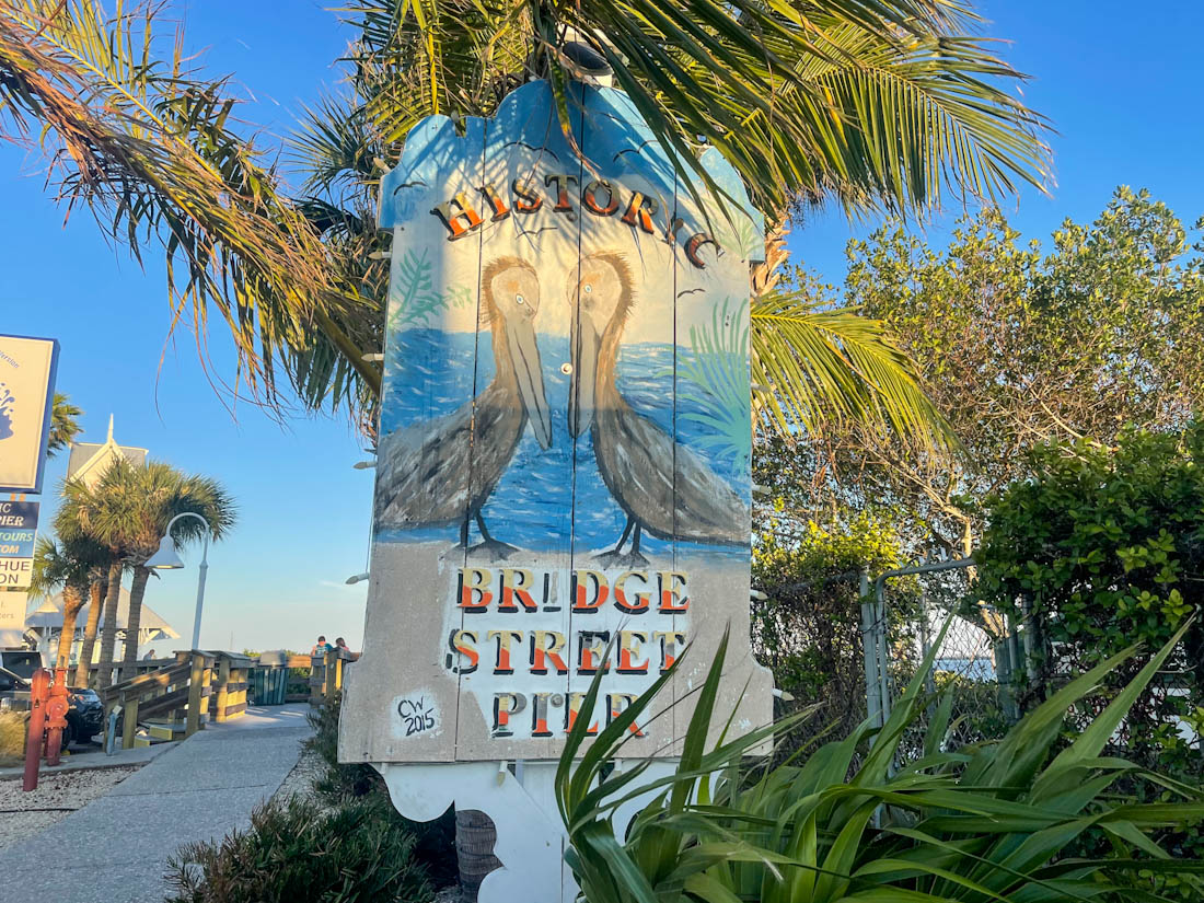 Historic Bridge Street Pier sign with pelicans on it in Anna Maria Island Florida