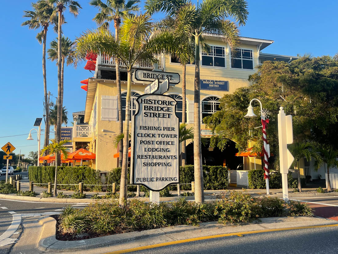 Historic Bridge Street sign with palm trees in Anna Maria Island Florida