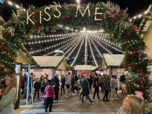 Kiss Me mistletoe arch at the Snowport Holiday Market in the Seaport Boston Massachusetts at Christmas