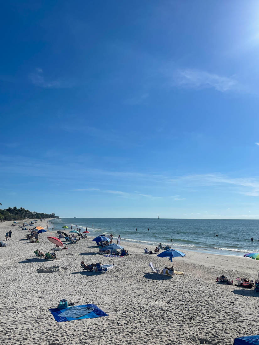 People sunbathing on Naples beach in Florida