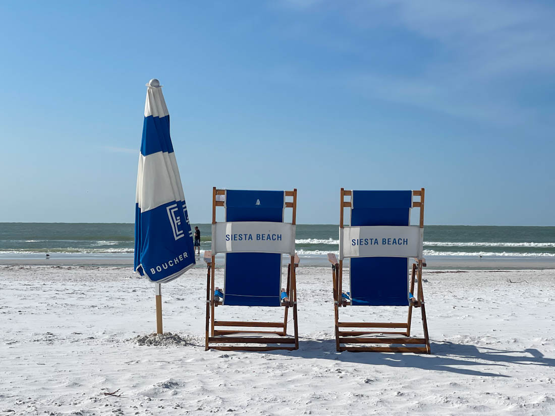 Blue sun chairs with Siesta Key on the back in Florida 