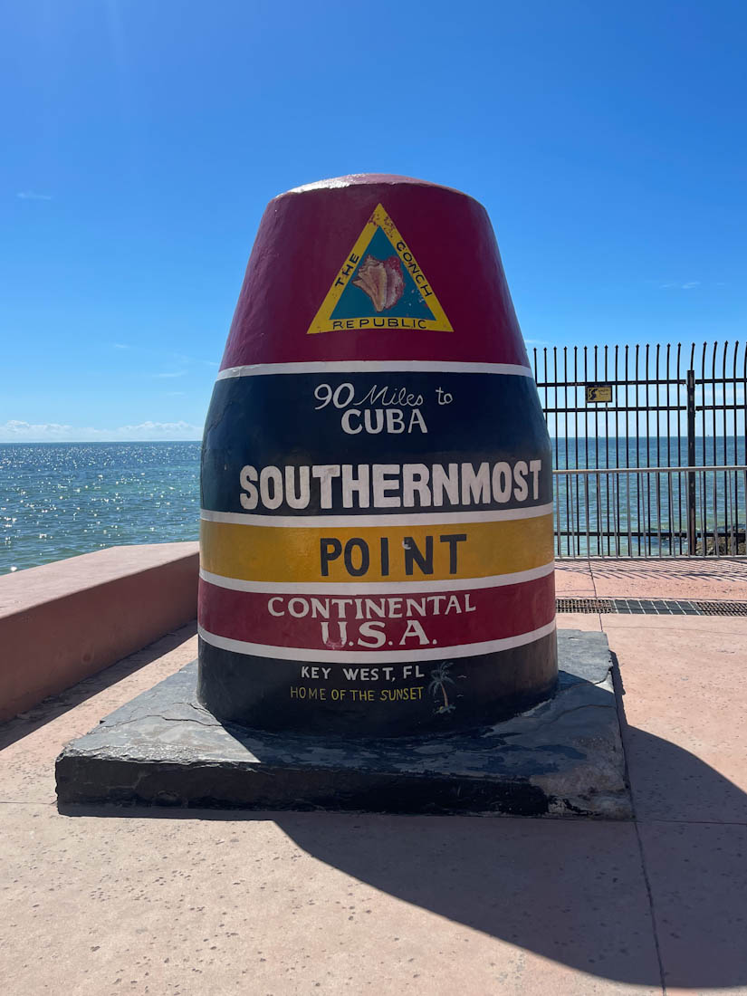 Southern most point continental USA Buoy in red, blue, and yellow stripes at Key West Florida