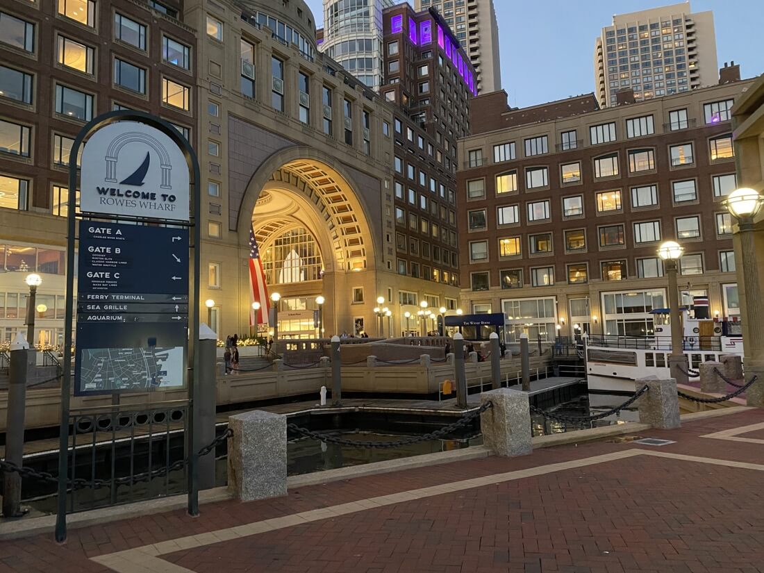 Welcome to Rowes Wharf sign on the water in Boston Massachusetts