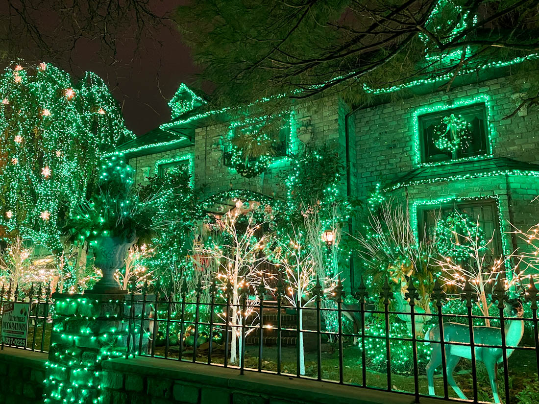 Green Christmas lights outside of Dyker Heights House NYC