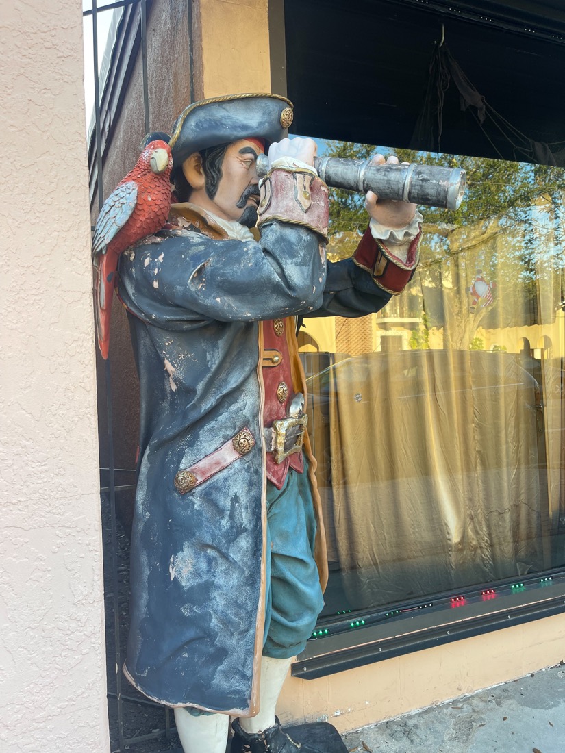 Pirate in window of Antilles Trading Company Maritime Pirate Museum and Store Cocoa Village Florida