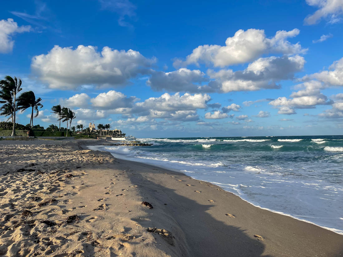 Sandy shore and blue skies of Palm Beach in Florida