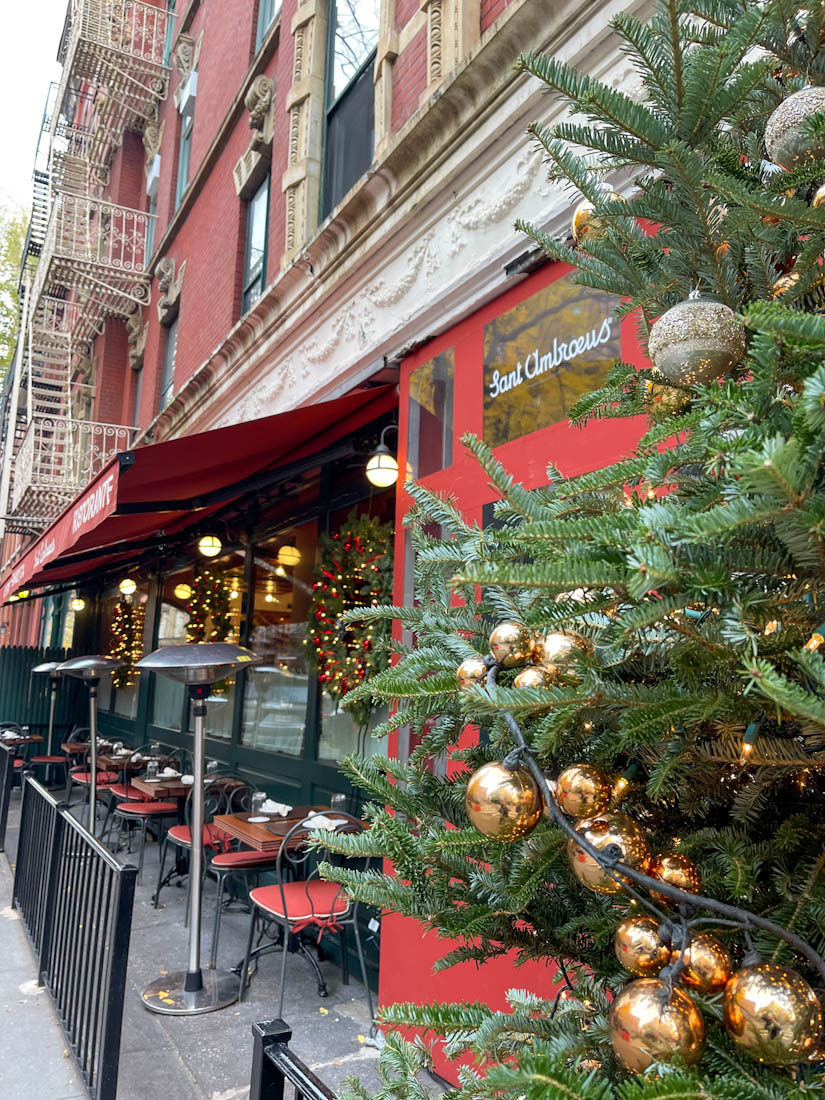 Outdoor seating at Sant Ambroeus West Village with Christmas tree