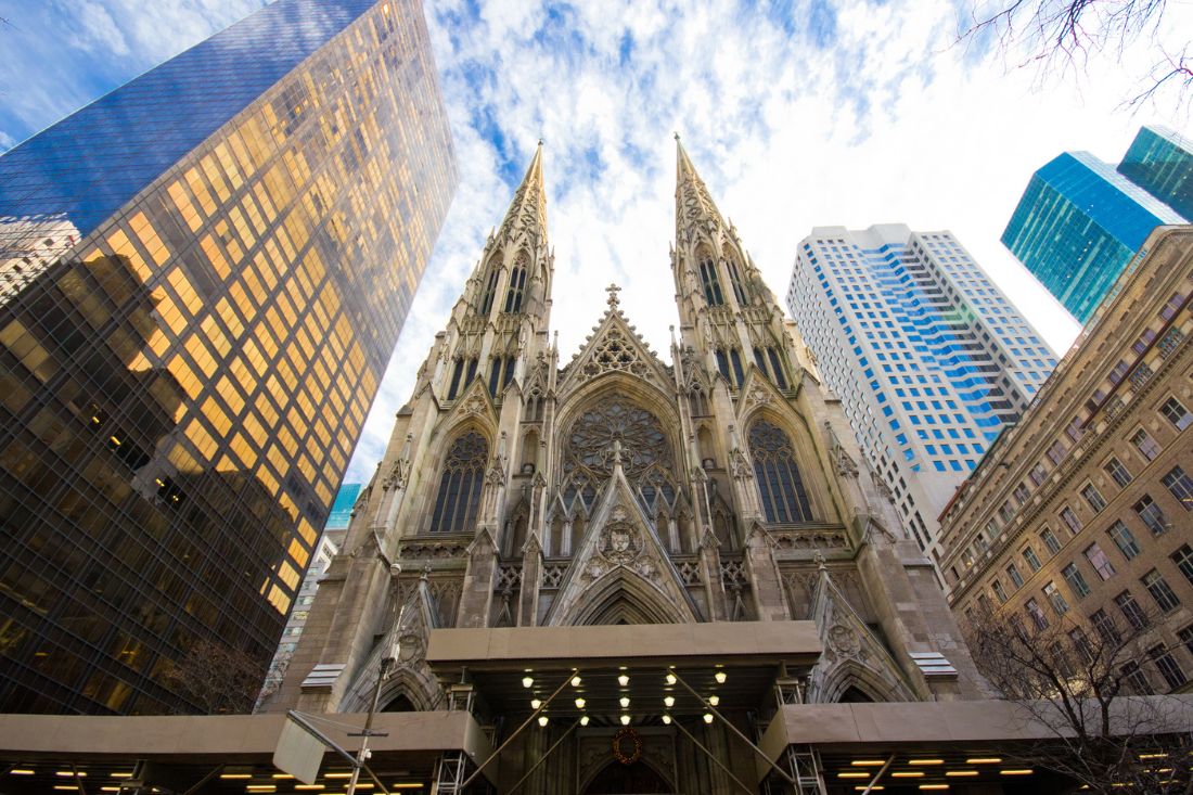 St. Patrick's Cathedral with views of nearby buildings in NYC.