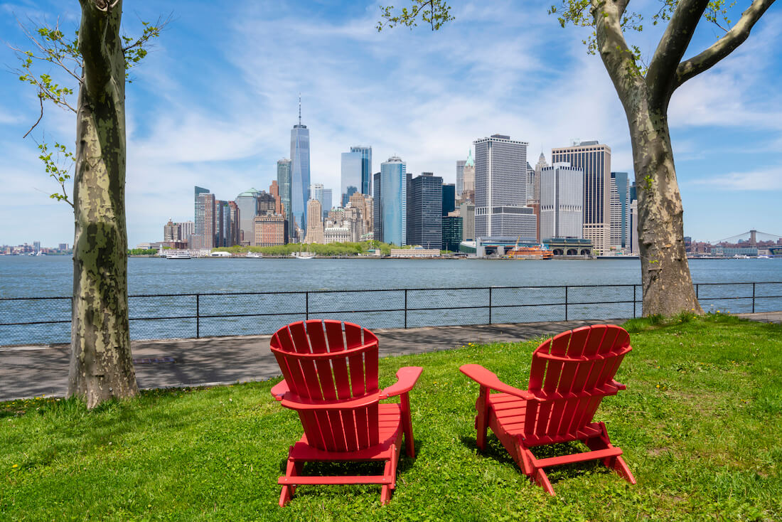 Chairs facing the skyline in New York City from Governors Island