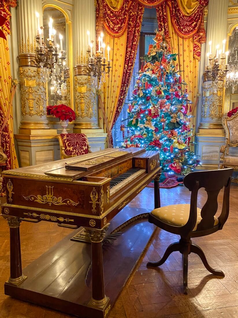 Christmas tree and piano in The Breakers mansion in Newport Rhode Island