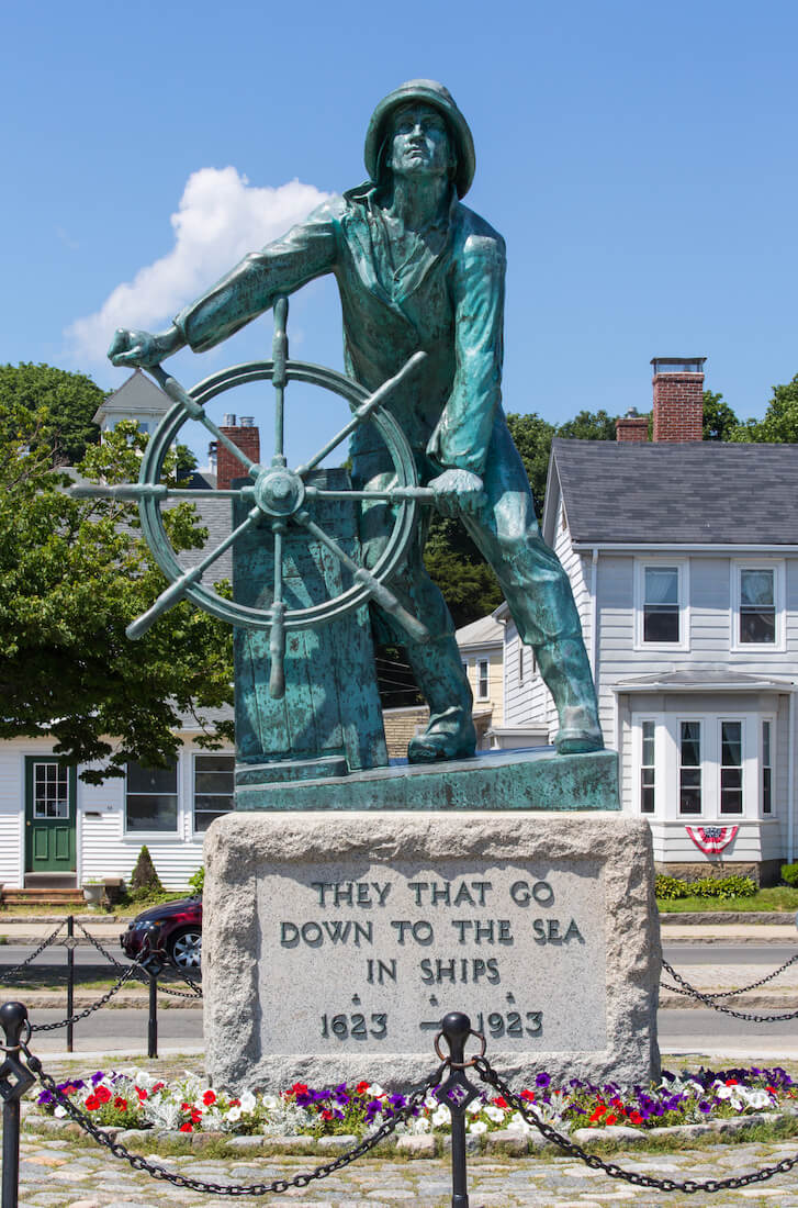 The Gloucester Fisherman's Memorial in Gloucester Massachusetts that reads "They that go down to the sea in ships"
