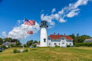 Chatham Light and US flag seen on Cape Cod in Massachusetts
