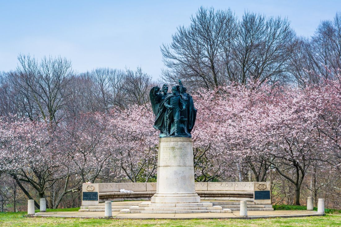Cherry blossoms and statue in Wyman Park, Baltimore, Maryland.