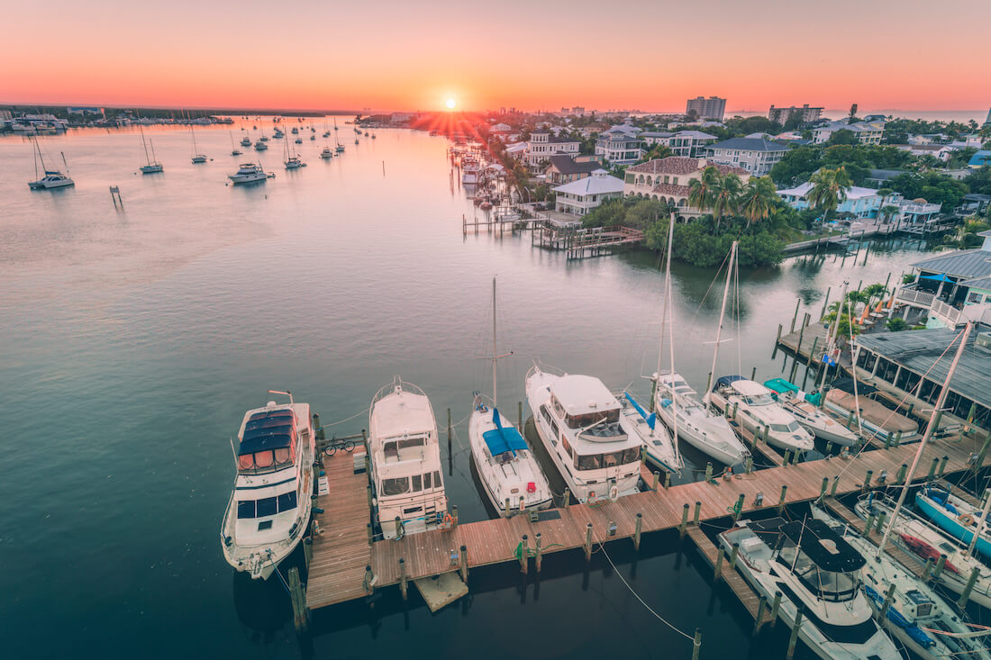 Boats docked in Fort Myers Beach, Florida at sunset