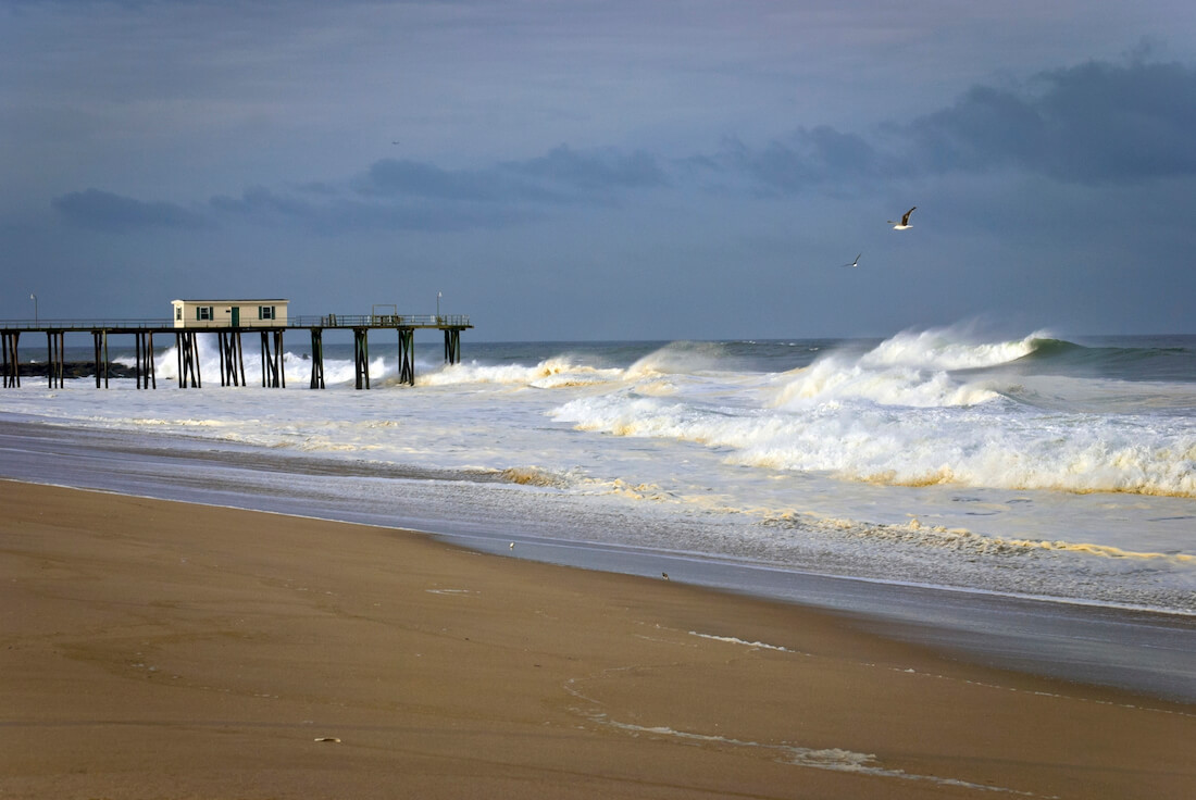 Belmar fishing pier and Atlantic shore waves in Belmar New Jersey